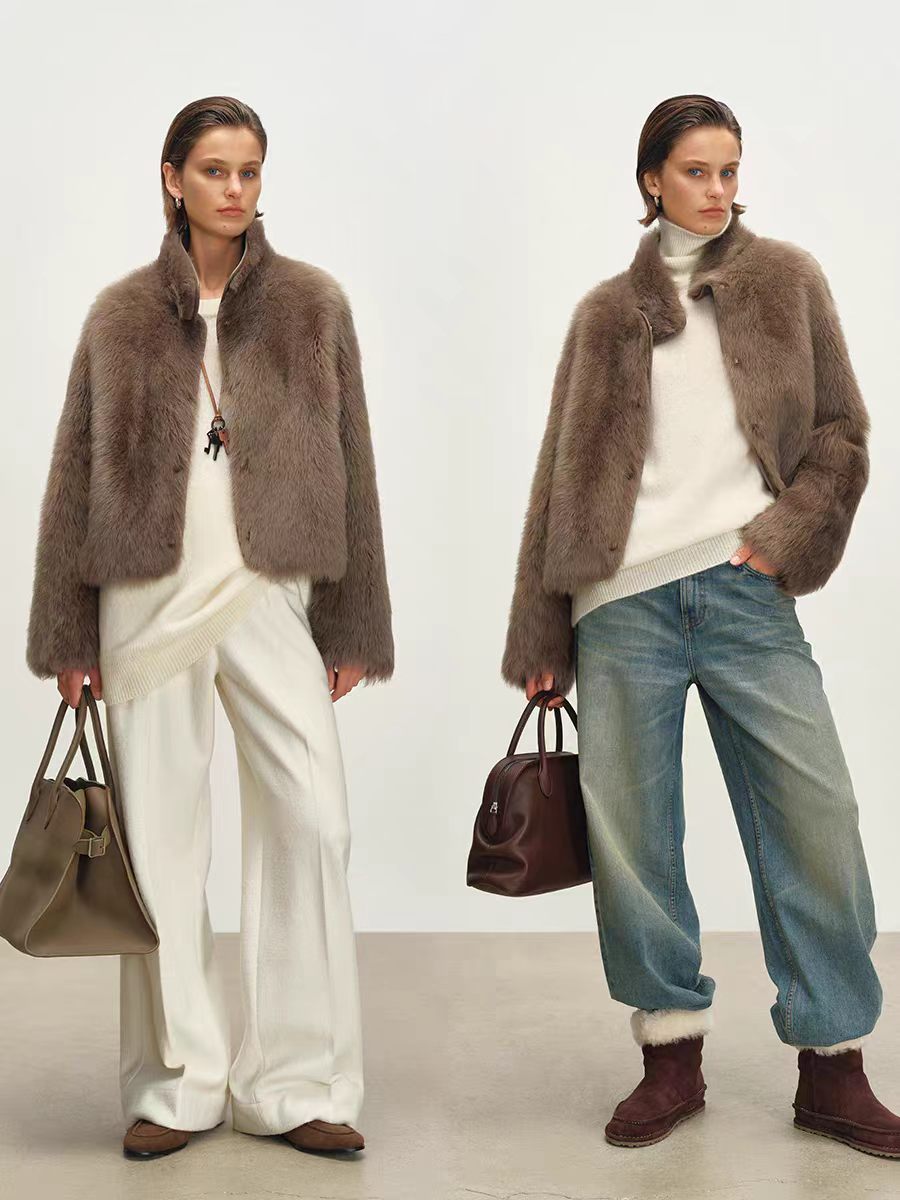 Women's short jacket featuring a stand collar, dropped shoulders, and a straight, slightly boxy silhouette—inspired by high-end Tuscan styles.